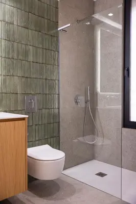 a bathroom with a toilet and a glass shower at Interlace by Holistays in Engomi