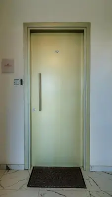 a large door in a building with the number on it at Element Stays City Suite in Nicosia
