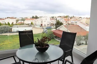 a glass table with a plant on a window at Modern 2BR near UNIC & Engomi Mall in Lakatamia