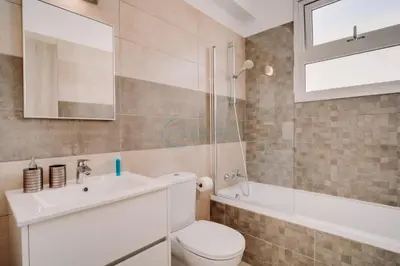 a bathroom with a toilet and a sink and a shower at Alasia 16 - Modern smart villa in tranquil serenity in Paralimni