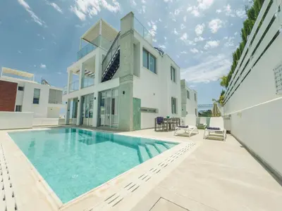 a swimming pool in the backyard of a house at Imperial Jade V4 - Villa Andriana in Protaras in Protaras