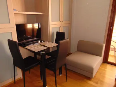 a small room with a table and a chair at Ithaki Phinikoudes Apartment No. 207 in Larnaka