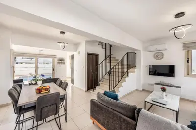 a living room with a couch and a table at villa Palms 31 in Protaras