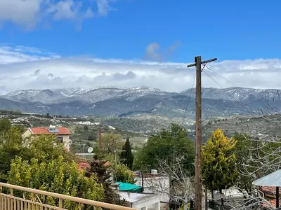 a view of a mountain range with a telephone pole at Omodos Village Houses in Omodos