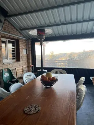 a bowl of fruit on a table in a room at Cherry Holiday House in Khandria