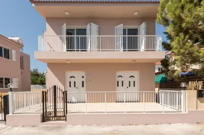a house with a balcony in front of it at Villa Marina in Ayia Napa