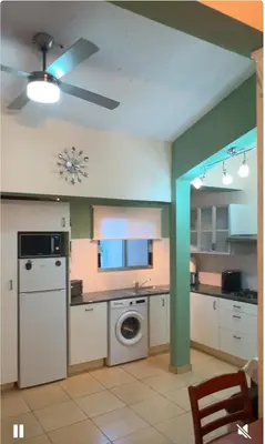 a kitchen with a washer and dryer in it at Bar street apartment in Ayia Napa