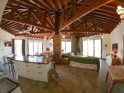 a large living room with a large wooden ceiling at Orama Mountain Villa Farmakas in Nicosia