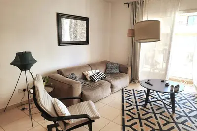 a living room with a couch and a table at Center, Walking to the Beach in Larnaka
