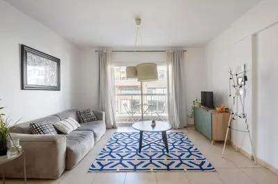 a living room with a couch and a table at Center, Walking to the Beach in Larnaka