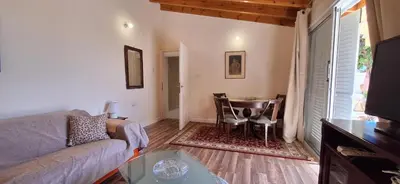 a living room with a couch and a table at Lydia's Sea View - 2 bed House in Episkopi Lemesou