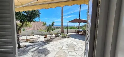 a view of a patio from the door of a house at Lydia's Sea View - 2 bed House in Episkopi Lemesou