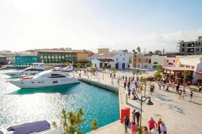 a boat docked at a marina in a city at Luxury Seafront 2 bedroom in Limassol
