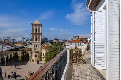 a view from the balcony of a building with a church at St Lazar Penthouse Apartment in Larnaka