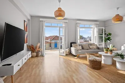 a living room with a large flat screen tv at St Lazar Penthouse Apartment in Larnaka