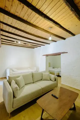a living room with a couch and a coffee table at Rustic Elegance in Omodos in Omodos