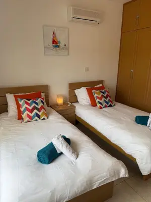 two beds sitting next to each other in a room at Green valley Tersefanou in Tersephanou