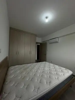 a bed in a room with a large mattress at Oroklini's Flat in Larnaka