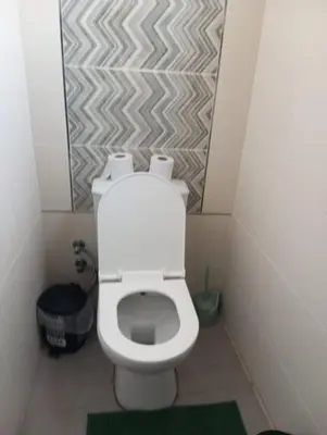 a bathroom with a white toilet in a stall at FLAT Ceremi in Nicosia