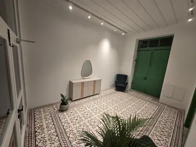 a room with a green door and a mirror at Green Leaf - Old City Suite in Limassol
