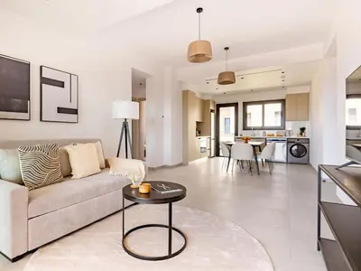 a living room with a couch and a table at Sanders Eduardovich Limassol in Limassol
