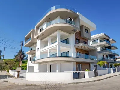 a white building with balconies on the side of it at Sanders Eduardovich Limassol in Limassol