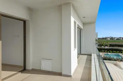an external view of a white building with a balcony at Serenity Waves Villa 2 in Larnaka