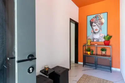 a room with a painting of a woman on the wall at The Pop Art Residences & Studios in Larnaca in Larnaka