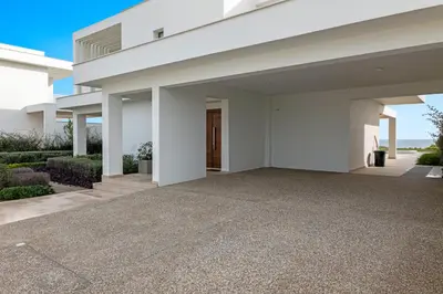 a large white house with a driveway at Serenity Waves Villa 5 in Larnaka