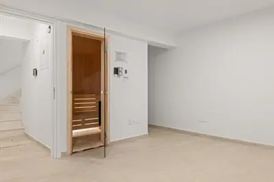 an empty room with a door in the wall at Serenity Waves Villa 8 in Sophtadhes
