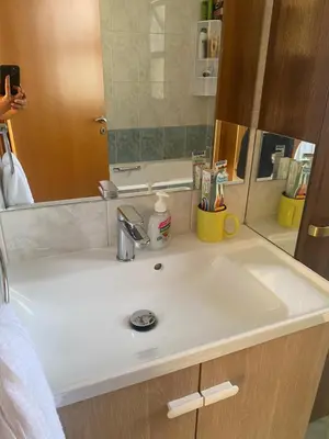 a bathroom counter with a sink and a mirror at A sea breeze house in Larnaka