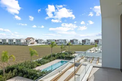a view of the pool from the balcony of a house at Serenity Waves Villa 20 in Larnaka