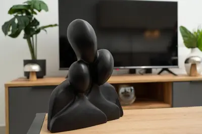 a black sculpture of a rabbit sitting on a table at 1 bedroom flat in Aglatzia in Aglantzia