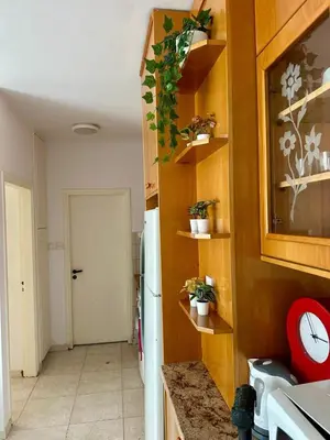a kitchen with a counter and a refrigerator in a room at 1 bedroom flat 200m from beach in Limassol