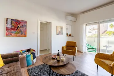 a living room with a couch and a table at Central Escape in Limassol