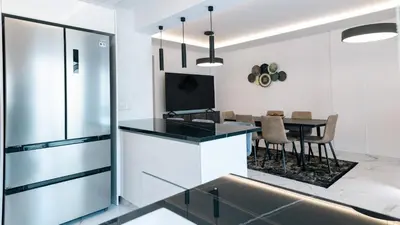 a kitchen and dining room with a table and chairs at Kozakos Residence in Limassol