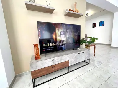 a living room with a large flat screen tv at Comfort Stay in Nicosia - Aglantzia RIK in Nicosia