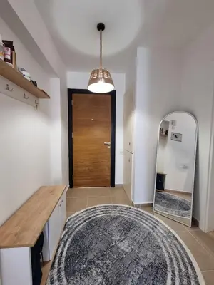 a living room with a mirror and a rug at North Cyprus Thalassa beach resort in Paralimni