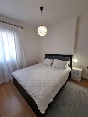a bedroom with a large bed and a pendant light at North Cyprus Thalassa beach resort in Paralimni