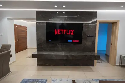 a lobby with a television on a wall at Lap of luxury in Limassol