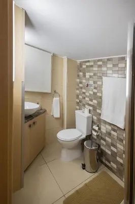 a bathroom with a toilet and a sink at Lap of luxury in Limassol