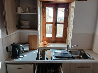 a kitchen with a sink and a window at Mountain View Oasis in Skarinou
