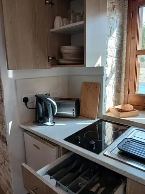 a kitchen counter with a sink and a sink at Mountain View Oasis in Skarinou