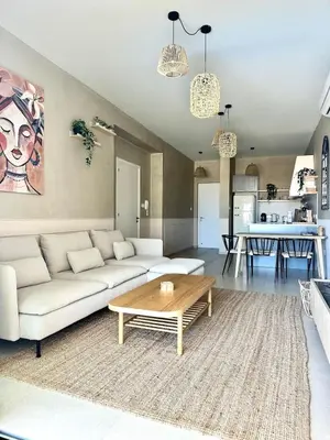 a living room with a couch and a coffee table at Bella at Mythical Seas in Paralimni
