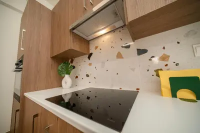 a kitchen with a wall with a rock climbing wall at Near City center 1 bedroom flat in Nicosia