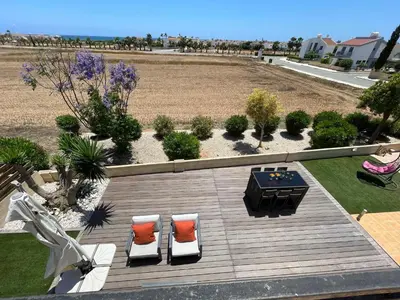 an aerial view of a patio with two chairs and a table at Maeva villa in Ayia Napa