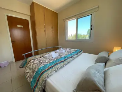 a bedroom with two beds and a window at Maeva villa in Ayia Napa