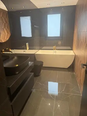 a bathroom with a tub and a toilet and a sink at Nicosia Delux in Nicosia