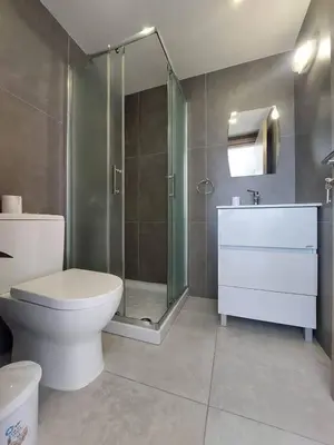 a bathroom with a shower and a toilet and a sink at Luxury 2 bedroom apartment 301 in Larnaka