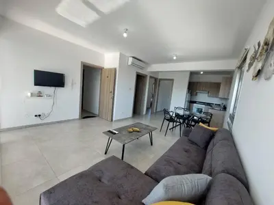 a living room with a couch and a table at Luxury 2 bedroom apartment 301 in Larnaka
